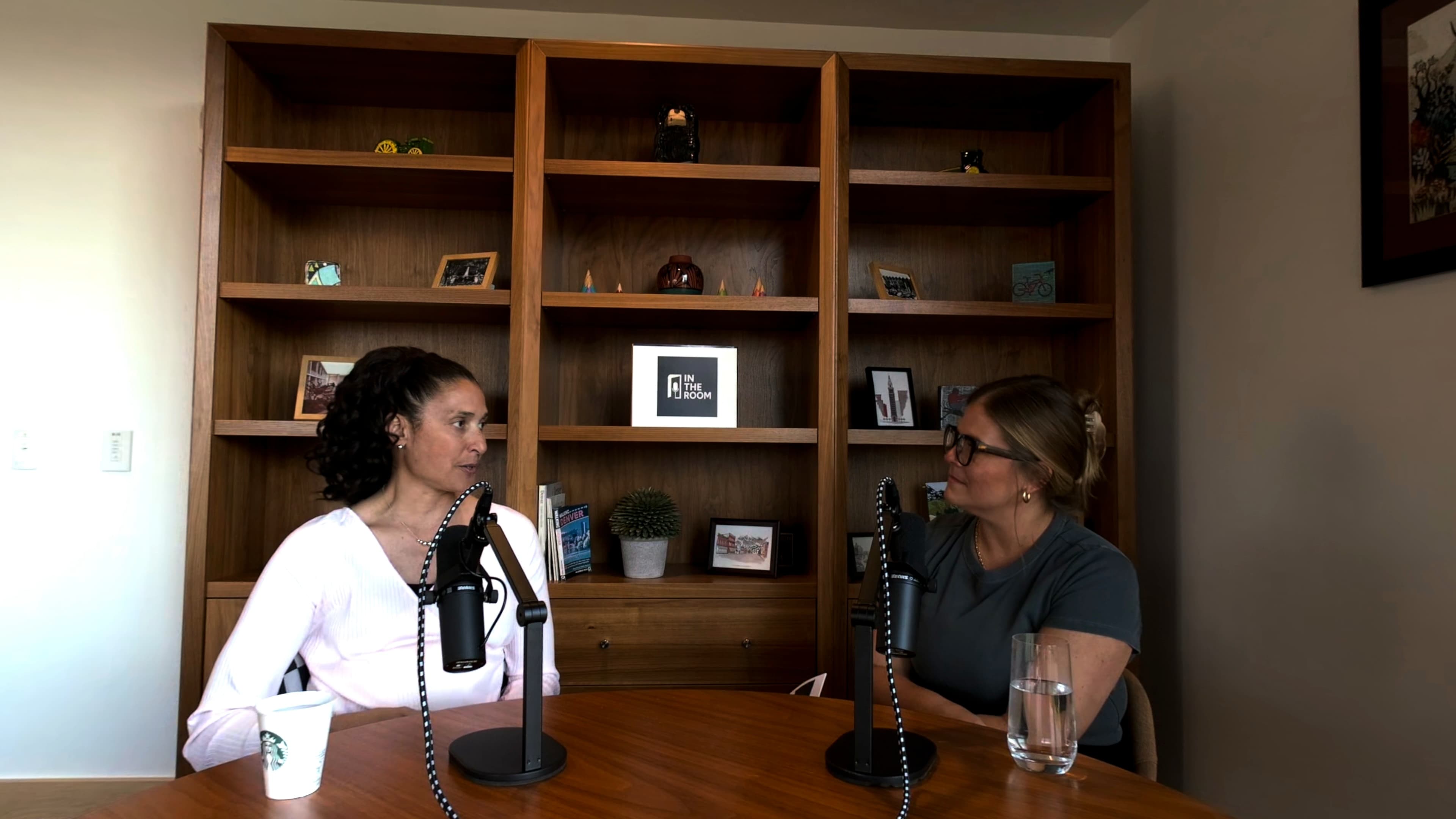 Lindsey Mandolini in conversation with a guest during an episode of the In the Room immersive video podcast.